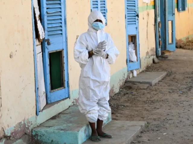 a health worker wears a protective outfit at a hospital where cholera patients are treated in sudan photo afp a health worker wears a protective outfit at a hospital where cholera patients are treated in sudan photo afp