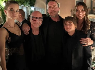 christian bale s entire family stuns in all black for rare public appearance at d g couture show christian bale s entire family stuns in all black for rare public appearance at d g couture show