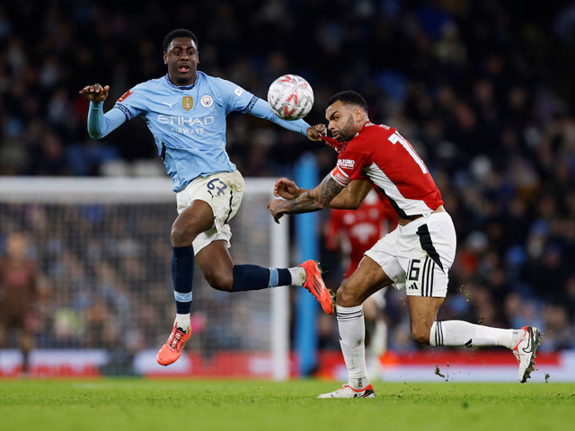 manchester city s divin mubama in action with salford city s curtis tilt photo reuters