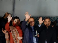 maryam nawaz sharif l nawaz sharif centre pm shahbaz sharif r gesture as they gather at the party office of pakistan muslim league n at model town in lahore on february 9 2024 photo reuters