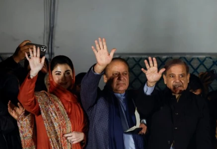 maryam nawaz sharif l nawaz sharif centre pm shahbaz sharif r gesture as they gather at the party office of pakistan muslim league n at model town in lahore on february 9 2024 photo reuters