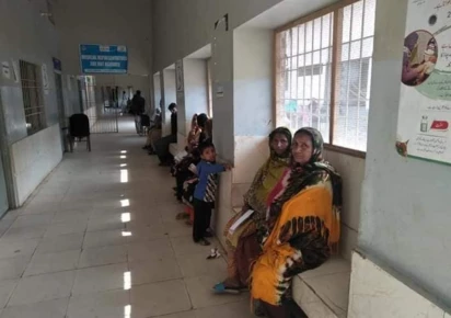 patients are sitting on benches inside the hospital corridor photo facebook com civilhospitalthatta