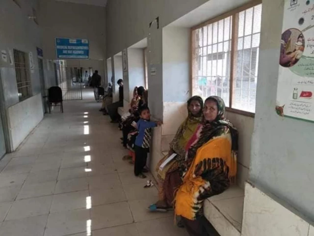 patients are sitting on benches inside the hospital corridor photo facebook com civilhospitalthatta