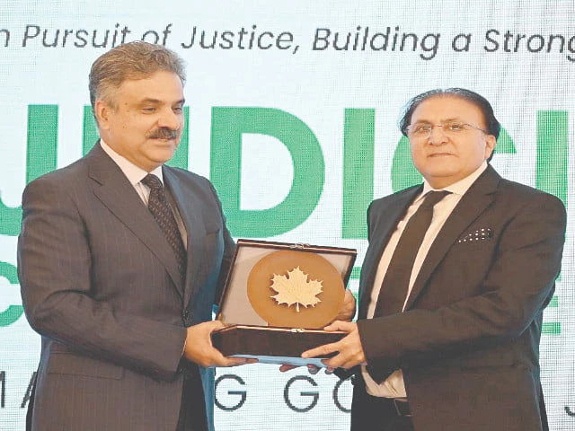 ajksc chief justice raja saeed akram presents a shield to cjp yahya afridi photo express
