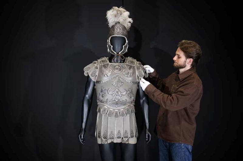 An employee poses with Mark Antony's Battle of Actium Costume, worn by Richard Burton in 'Cleopatra', at Propstore in Chenies, Britain, September 30, 2024. PHOTO: REUTERS