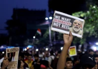 a man holds a poster as he participates in a demonstration held in solidarity with cockroach janta party cjp protests held at jantar mantar in new delhi which demand the resignation of india s education minister dharmendra pradhan over exam paper leaks in kolkata india july 24 2026 photo reuters