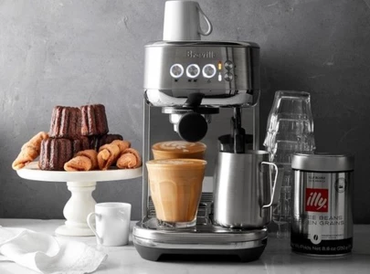 travel influencer tara woodcox sparks backlash over hotel coffee maker confession