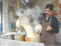 a vendor serves tea on a chilly evening in lahore as cold and dry weather is forecast across most of the country on thursday photo online