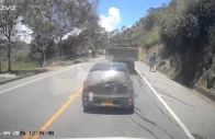 dashcam footage shows a person running as debris flies through the air in the distance at the moment of the explosion that killed over a dozen people in cajibio cauca colombia april 25 2026 reuters