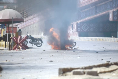 a motorcycle burns after being set ablaze by unidentified men near the us consulate during a protest against the assassination of iran s supreme leader ayatollah ali khamenei in israeli us airstrikes on the islamic republic photo ppi
