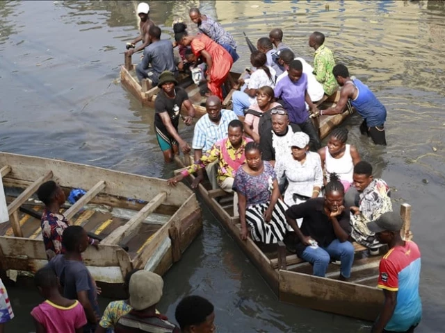 people are moving in boats after flood in eastern dr congo photo anadolu agency