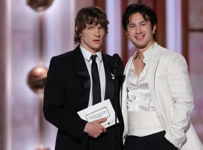 hudson williams and connor storrie carry olympic flame at milano cortina 2026 hudson williams and connor storrie carry olympic flame at milano cortina 2026