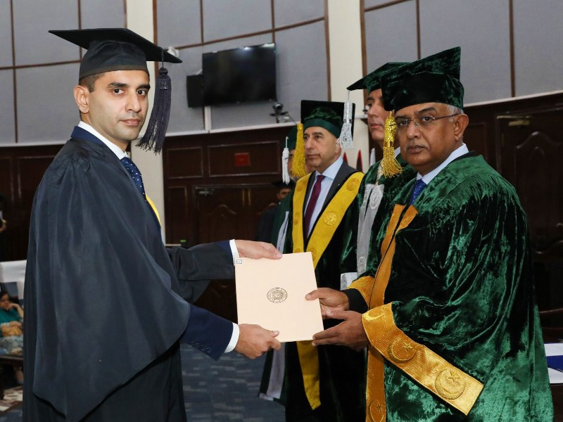 chief of the naval staff admiral naveed ashraf confers degree upon a court participant during the 53rd pn staff course convocation at pn war college lahore photo ispr