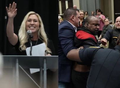 watch marjorie taylor greene laughs as two protestors tased at townhall watch marjorie taylor greene laughs as two protestors tased at townhall