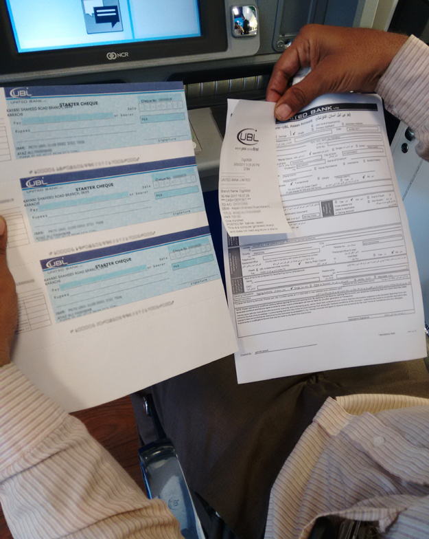 A copy of the filled account opening form and pre-activated cheques. PHOTO: UBL