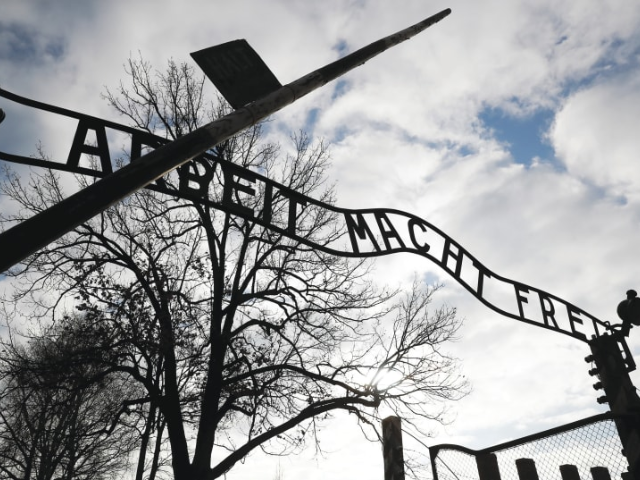 the front gate of auschwitz carries the infamous phrase arbeit macht frei the writer states perhaps we as jews are less alone in our grief than we may fear photo credit kacper pempel reuters