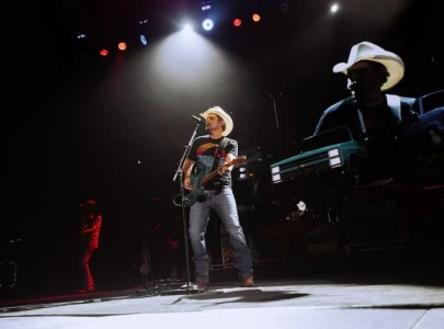 country star brad paisley surrounded by police during concert country star brad paisley surrounded by police during concert