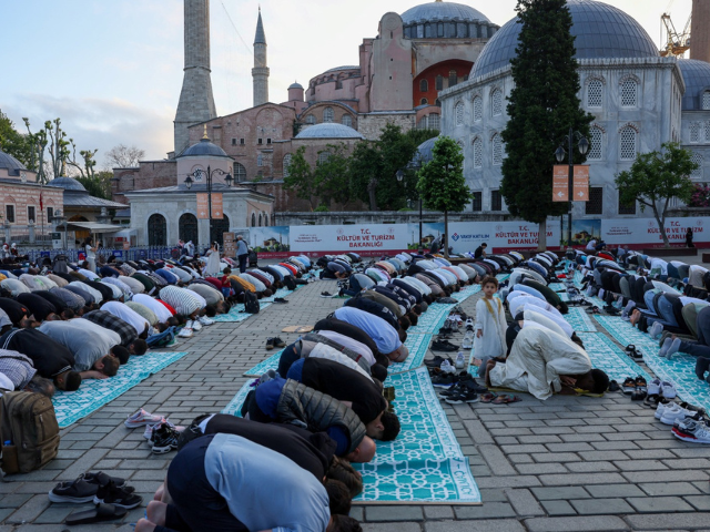 Worshippers attend prayers on the first day of Muslim holiday of Eid al-Adha, outside the Ayasofya-i Kebir Camii or Hagia Sophia Grand Mosque in Istanbul, Turkiye, June 6, 2025. 