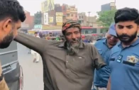 watch beggar pretending to have no arms caught red handed in lahore