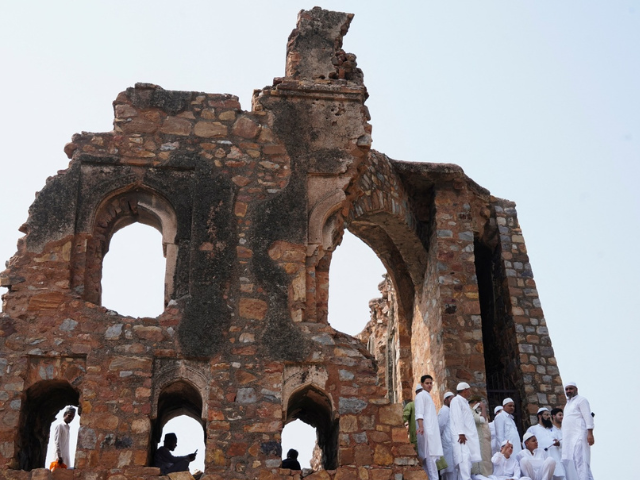 Muslims stand amidst the ruins of Feroz Shah Kotla mosque after offering prayers on the occasion of Eid-al-Adha in New Delhi, India, June 7, 2025. REUTERS/Bhawika Chhabra