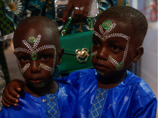Muslim boys with decorative paint on their faces look on, while Muslims in Ivory Coast continue to celebrate, a day after the Muslim holiday of Eid al-Adha in Abidjan, Ivory Coast June 7, 2025 REUTERS/Luc Gnago