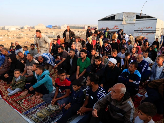palestinian men and boys perform eid al adha prayers in khan younis in the southern gaza strip june 6 2025 reuters hatem khaled