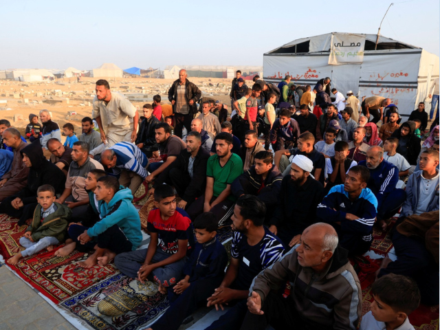 Palestinian men and boys perform Eid al-Adha prayers in Khan Younis, in the southern Gaza Strip, June 6, 2025. REUTERS/Hatem Khaled