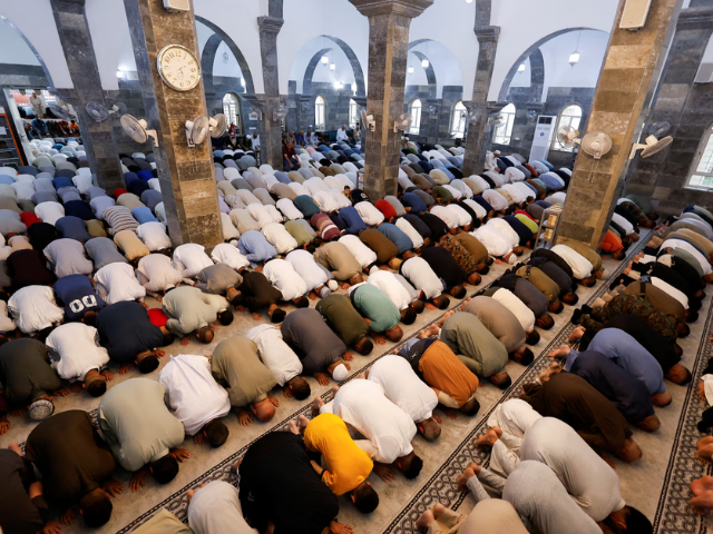 Sunni Muslims attend Eid al-Adha prayer in Mosul, Iraq, June 6. REUTERS/Khalid Al-Mousily