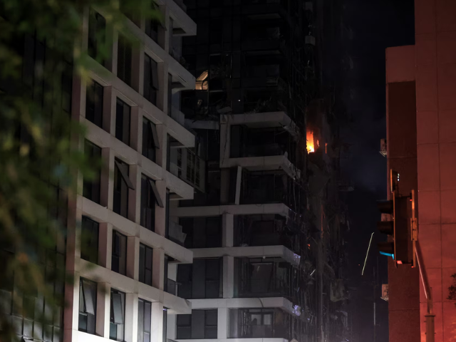 Fire burns in a building at an impact site following a missile attack from Iran on Israel, at Tel Aviv, Israel, June 13. REUTERS/Itai Ron