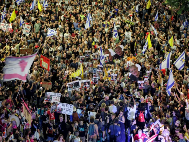 An estimated 60,000 Israelis joined a protest organised by family and supporters of captives held in Gaza in Tel Aviv on Saturday night [Jack Guez/AFP]