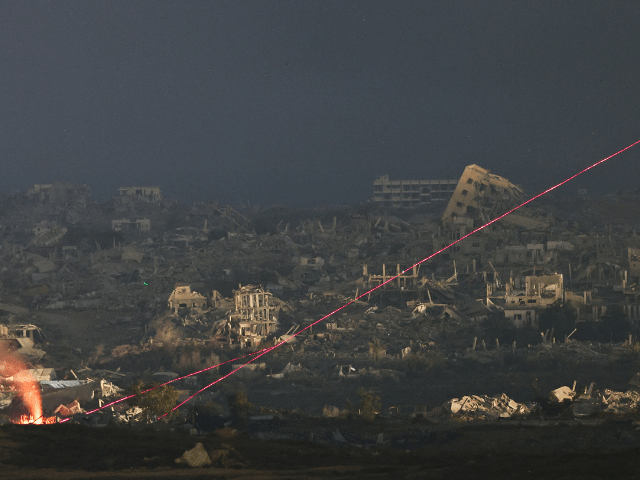 A view shows beams of light in Gaza, as seen from the Israeli side of the Israel-Gaza border on July 13, 2025. — Reuters