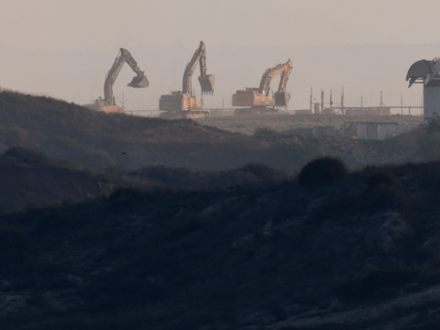 Excavators enter Gaza, on the Israel-Gaza border, as seen from the Israeli side of the Israel-Gaza border on July 10, 2025. — Reuters