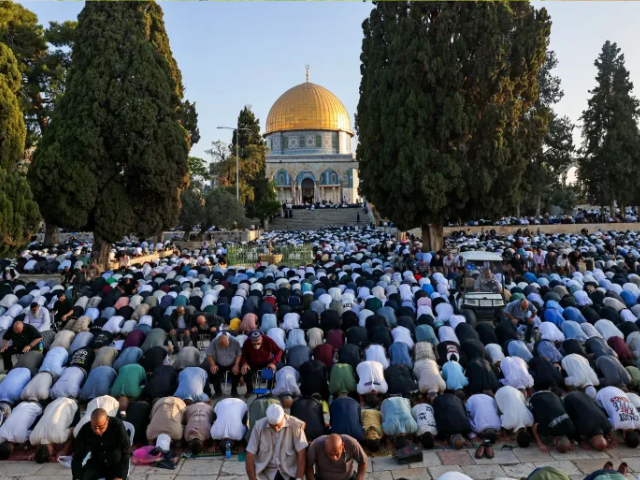 Muslims participate in a special morning prayer on the first day of the Eid al-Adha festival at the Al-Aqsa Mosque compound in occupied Jerusalem [Ahmad Gharabli/AFP]