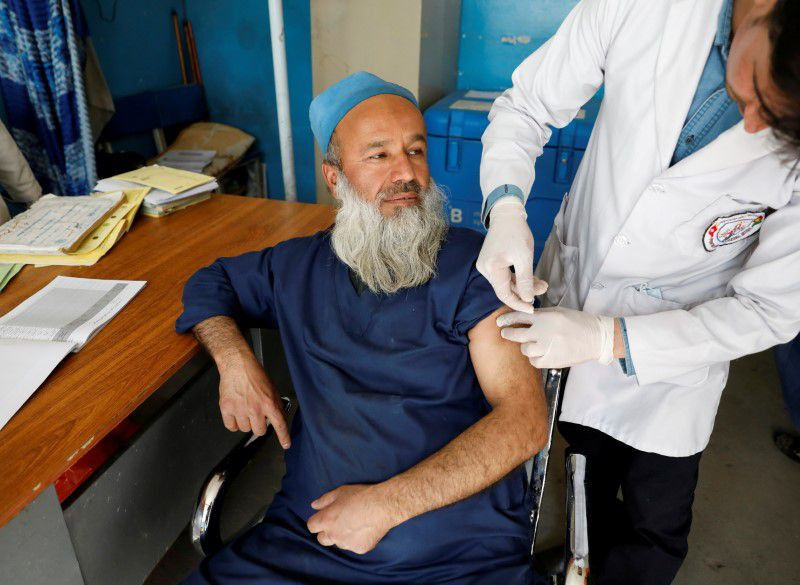 a hospital worker receives the first dose of astrazeneca s vaccine against the coronavirus disease covid 19 at a hospital in kabul afghanistan february 28 2021 reuters file photo