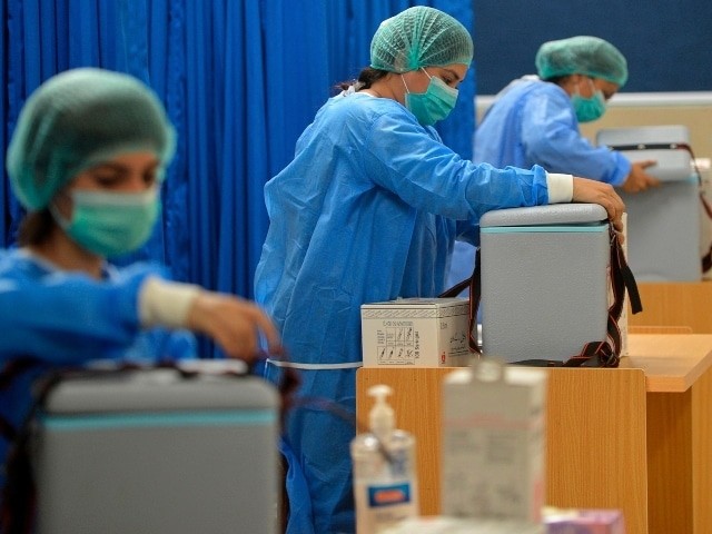 medical attendants prepare to vaccinate health workers with chinese made sinopharm covid 19 vaccine at a vaccination centre on february 3 photo afp