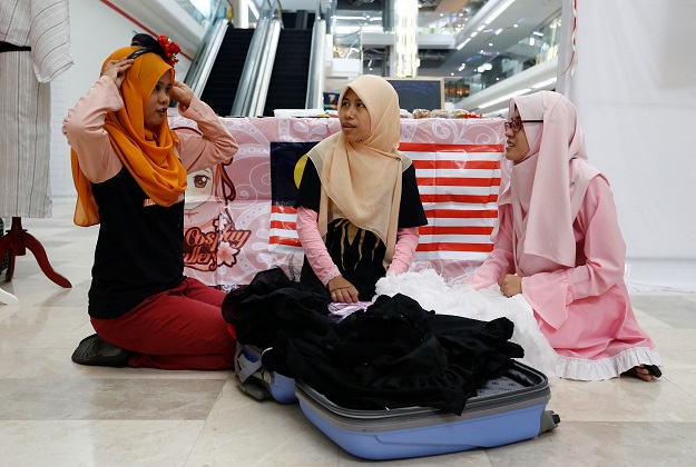 Muslim cosplayers prepare for a cosplay event at a mall in Petaling Jaya, near Kuala Lumpur, Malaysia. PHOTO: REUTERS