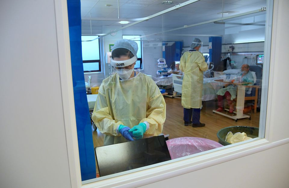a member of staff takes off ppe in the hdu high dependency unit at milton keynes university hospital amid the spread of the coronavirus disease covid 19 pandemic milton keynes britain january 20 2021 picture taken january 20 2021 reuters toby melville