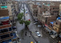 commuters make their way through a flooded street during heavy monsoon rains in hyderabad on july 14 2025 photo afp commuters make their way through a flooded street during heavy monsoon rains in hyderabad on july 14 2025 photo afp