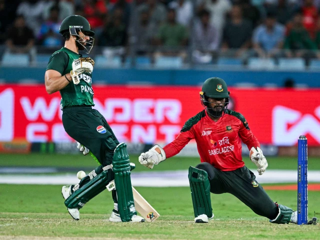 pakistan s captain salman agha takes a run as wicketkeeper captain jaker ali fields the ball during the asia cup 2025 super four twenty20 international match at the dubai international stadium in dubai on september 25 2025 photo afp