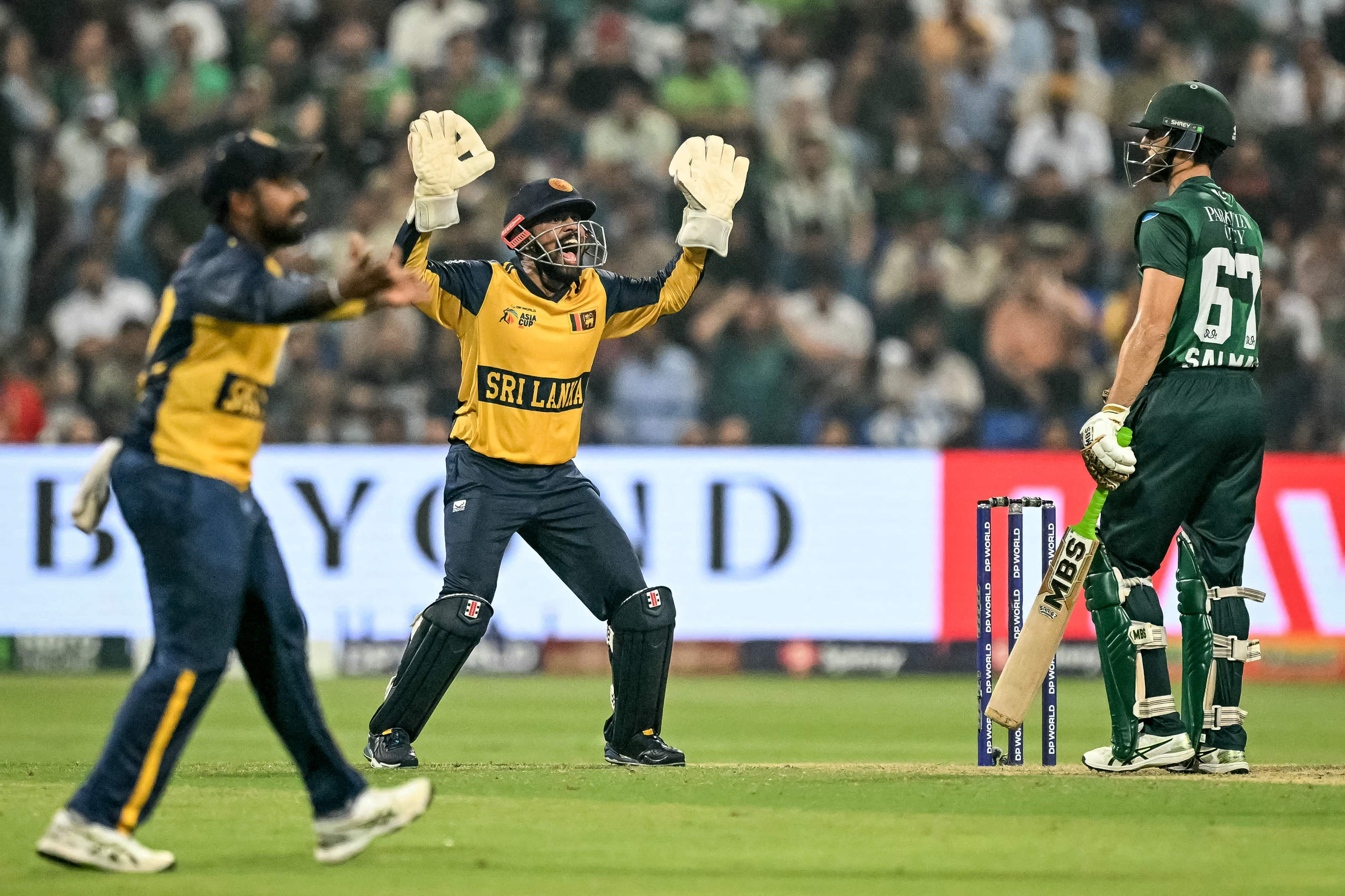 Sri Lanka's Kusal Mendis (C) successfully appeals for leg before wicket (LBW) against Pakistan's captain Salman Agha (R) during the Asia Cup 2025 Super Four Twenty20 international match at the Sheikh Zayed Cricket Stadium in Abu Dhabi. PHOTO: AFP
