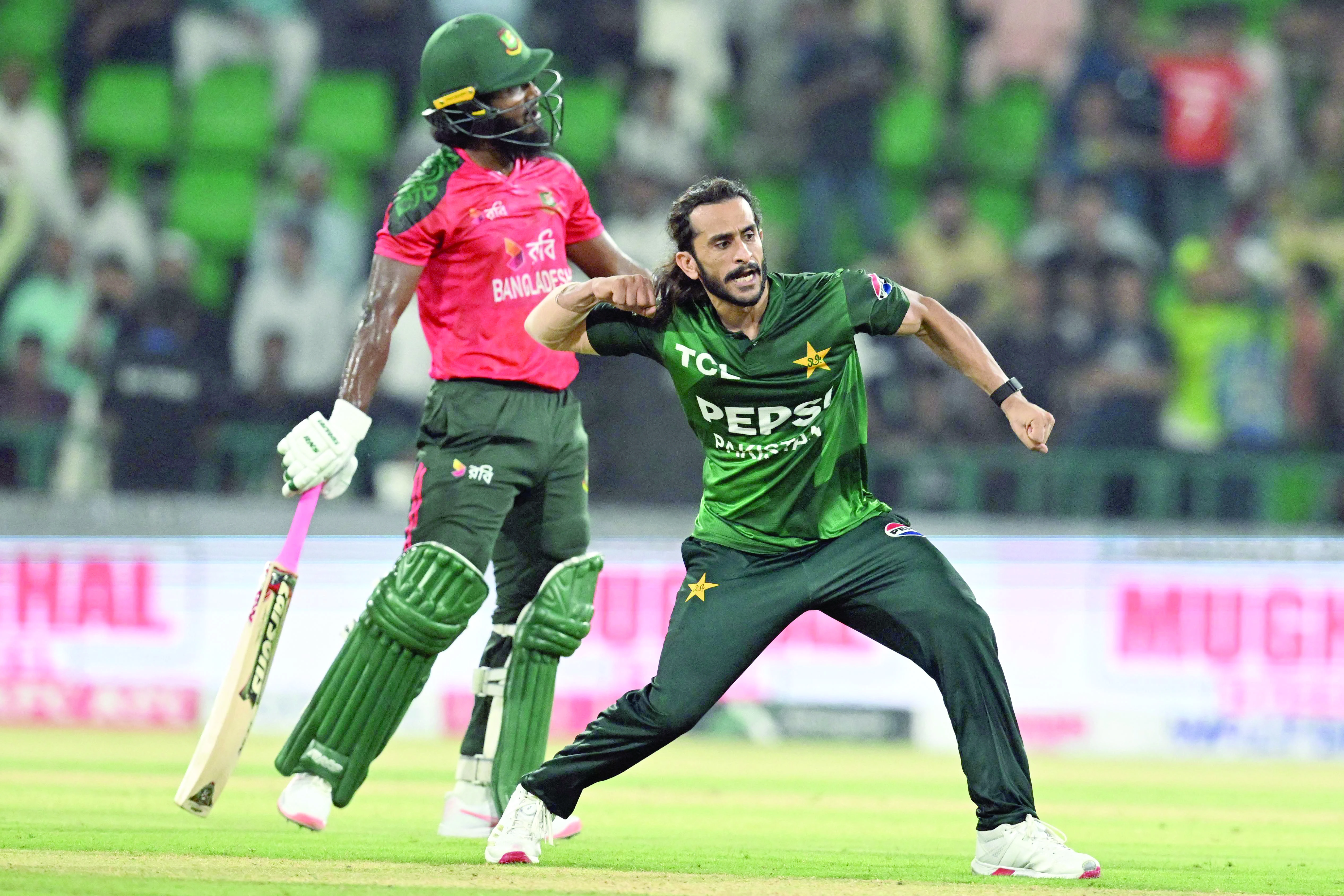 pacer hasan ali celebrates after taking wicket of bangladesh s jaker ali l during the first twenty20 international match between pakistan and bangladesh at the gaddafi stadium in lahore photo afp