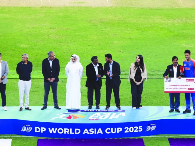 asian cricket council and pakistan cricket board chairman mohsin naqvi stands on the podium with emirates cricket board vice chairman khalid al zarooni during the awards presentation ceremony at the dubai international cricket stadium photo reuters