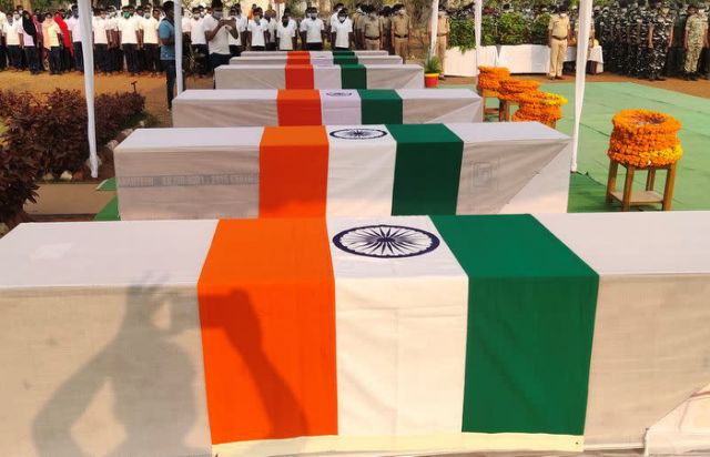 security force personnel pay homage next to the coffins of their colleagues who were killed in an attack by maoist fighters during a wreath laying ceremony in bijapur in chhattisgarh india april 5 2021 reuters