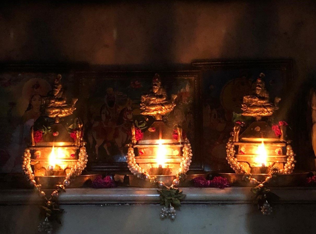 Lit Lamps at Hindu Mandir at Udero Lal. Photo Courtesy: Author.