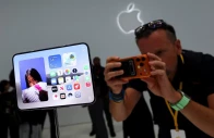 a man records images of the new foldable iphone duo on display during apple s event at the steve jobs theater in cupertino california us september 9 2026 reuters