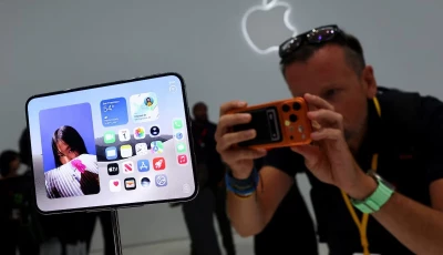a man records images of the new foldable iphone duo on display during apple s event at the steve jobs theater in cupertino california us september 9 2026 reuters