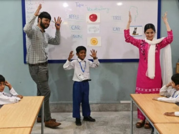 teachers lead a class of hearing impaired students at a school in lahore run by the charity deaf reach a non profit organisation working to empower disadvantaged deaf children and youths photo afp