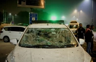 people stand next to a vehicle with its windshield cracked following an explosion in the old quarters of delhi india november 10 2025 photo reuters