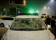 people stand next to a vehicle with its windshield cracked following an explosion in the old quarters of delhi india november 10 2025 photo reuters