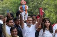 congress leader and leader of the opposition rahul gandhi holds a doll depicting indian prime minister narendra modi as opposition parties march to the supreme court to protest a controversial revision of voter lists that has sparked days of unrest in new delhi india reuters